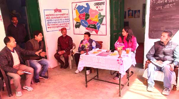 District Magistrate Pithoragarh Reena Joshi taking food with students