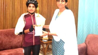 District Magistrate Mrs. Sonika met the cycle rider Ms. Asha Malviya who went on a country tour