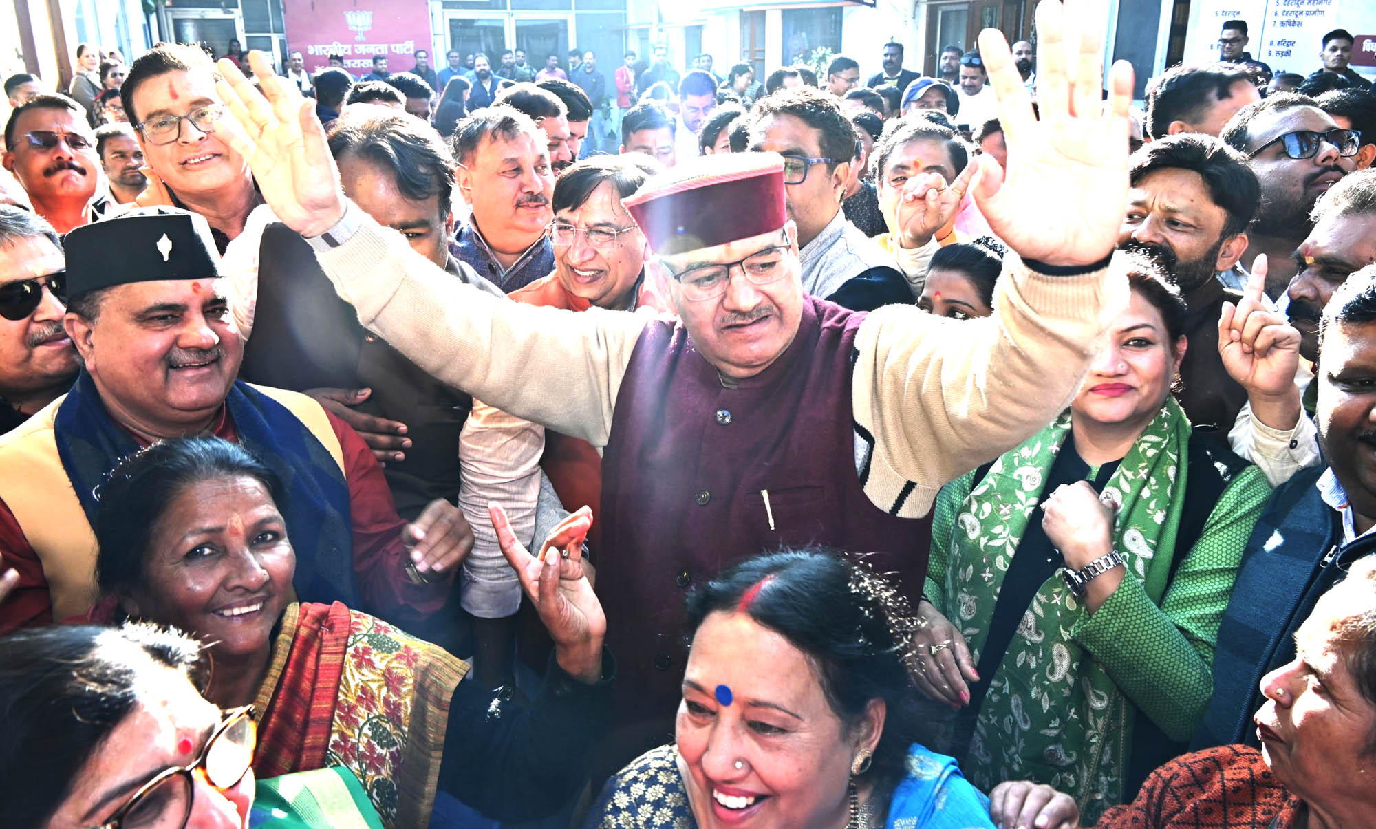 Cabinet Minister Ganesh Joshi celebrates BJP's landslide victory in three states at BJP state office