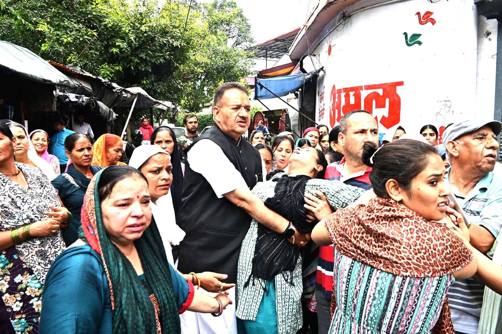 Minister Ganesh Joshi stopped his convoy and took the woman who became unconscious due to a sudden paralysis attack while mourning the death of her mother, to the hospital in his car.